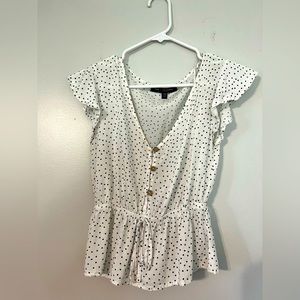 White and black polka dot blouse